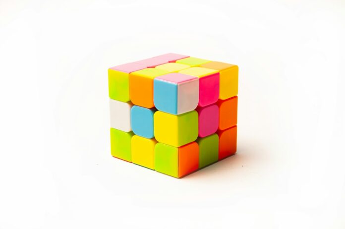 Photo by Lidia Nemiroff a rubik cube on a white background