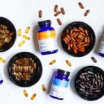 “나만의 맞춤 영양, 실속 있게 챙기기…보충제 트렌드와 건강 실천법” blue and white plastic bottle beside brown round ashtray