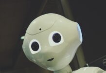 일상 속 건강 지킴이, AI가 알려주는 맞춤형 습관 white robot toy holding black tablet
