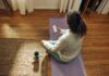 스트레스, 일상 속 작은 변화로 관리한다…최근 주목받는 ‘마이크로 습관’ 실천법 Woman meditating on yoga mat with phone and drink.