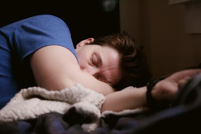 Photo by Shane man in blue shirt sleeping